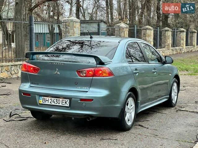 Зелений Міцубісі Lancer, об'ємом двигуна 2 л та пробігом 135 тис. км за 5700 $, фото 13 на Automoto.ua