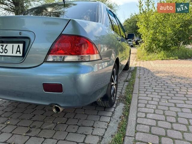 Зеленый Мицубиси Лансер, объемом двигателя 1.6 л и пробегом 137 тыс. км за 5500 $, фото 30 на Automoto.ua