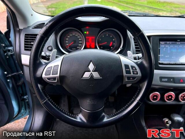 Зеленый Мицубиси Лансер, объемом двигателя 2 л и пробегом 128 тыс. км за 5777 $, фото 8 на Automoto.ua