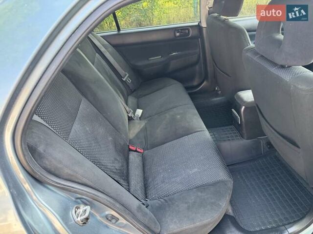 Зеленый Мицубиси Лансер, объемом двигателя 1.6 л и пробегом 137 тыс. км за 5500 $, фото 19 на Automoto.ua