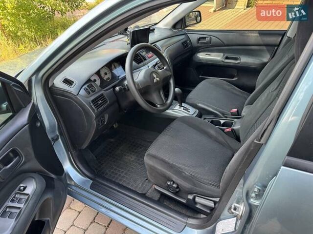 Зеленый Мицубиси Лансер, объемом двигателя 1.6 л и пробегом 137 тыс. км за 5500 $, фото 24 на Automoto.ua