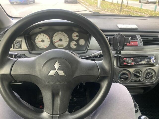 Зеленый Мицубиси Лансер, объемом двигателя 1.6 л и пробегом 167 тыс. км за 3500 $, фото 7 на Automoto.ua