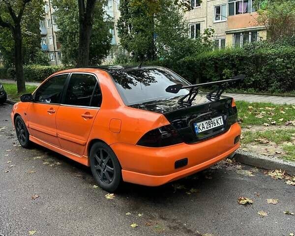 Оранжевый Мицубиси Лансер, объемом двигателя 1.59 л и пробегом 325 тыс. км за 4300 $, фото 5 на Automoto.ua