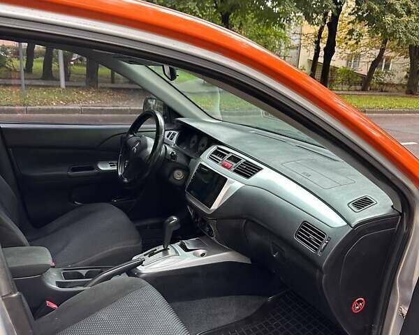 Оранжевый Мицубиси Лансер, объемом двигателя 1.59 л и пробегом 325 тыс. км за 4300 $, фото 2 на Automoto.ua