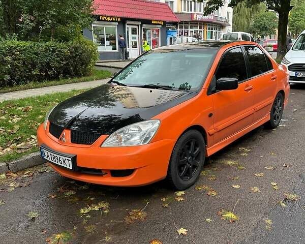 Оранжевый Мицубиси Лансер, объемом двигателя 1.59 л и пробегом 325 тыс. км за 4300 $, фото 1 на Automoto.ua