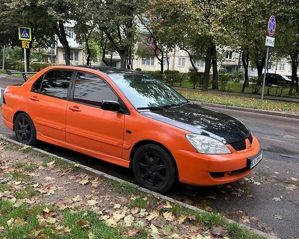 Оранжевый Мицубиси Лансер, объемом двигателя 1.59 л и пробегом 325 тыс. км за 4300 $, фото 3 на Automoto.ua