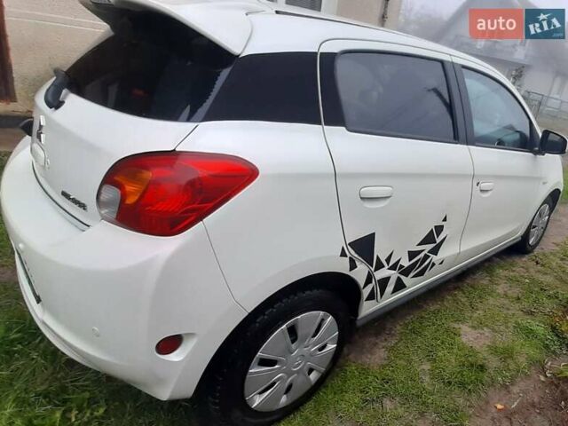 Белый Мицубиси Мираж, объемом двигателя 1.19 л и пробегом 148 тыс. км за 6550 $, фото 5 на Automoto.ua