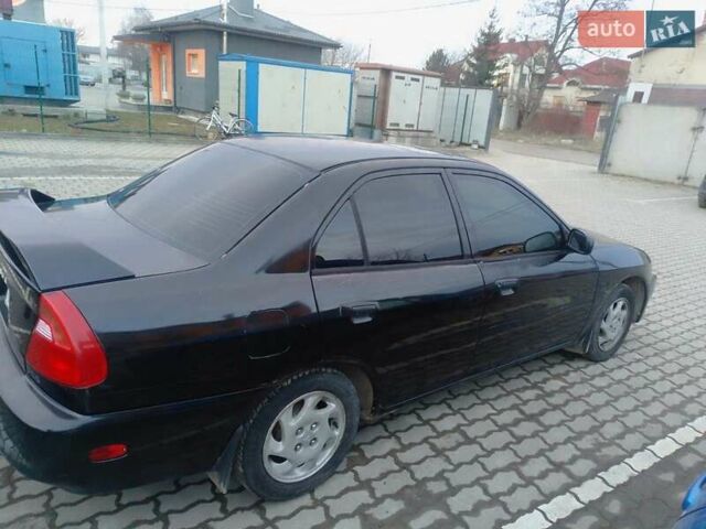 Черный Мицубиси Мираж, объемом двигателя 1.8 л и пробегом 240 тыс. км за 2500 $, фото 1 на Automoto.ua