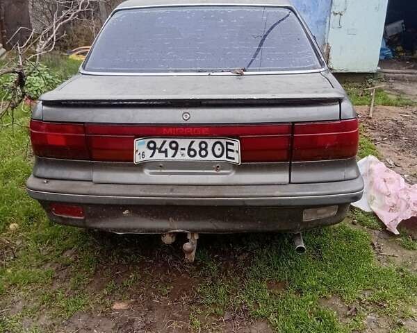 Серый Мицубиси Мираж, объемом двигателя 1.5 л и пробегом 400 тыс. км за 500 $, фото 1 на Automoto.ua