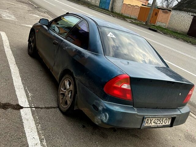 Зеленый Мицубиси Мираж, объемом двигателя 1.5 л и пробегом 165 тыс. км за 1900 $, фото 7 на Automoto.ua