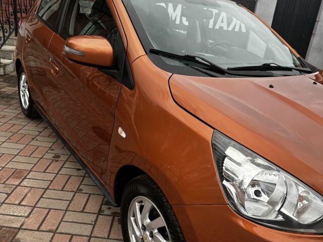 Помаранчевий Міцубісі Міраж, об'ємом двигуна 1.2 л та пробігом 110 тис. км за 6800 $, фото 4 на Automoto.ua