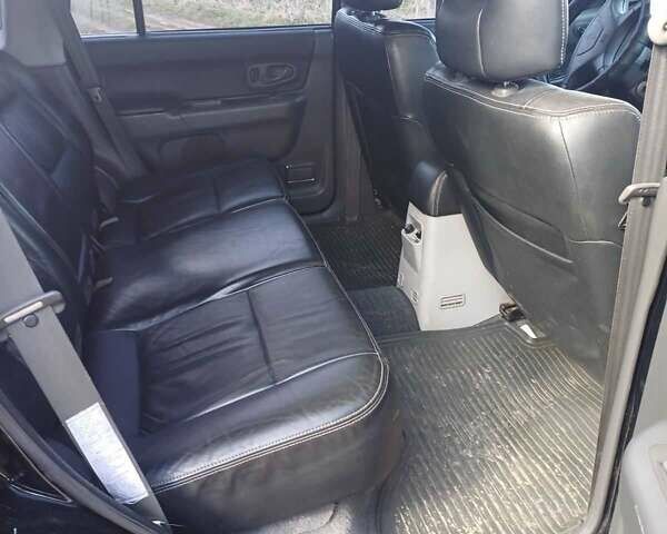 Черный Мицубиси Монтеро, объемом двигателя 3 л и пробегом 100 тыс. км за 11000 $, фото 6 на Automoto.ua