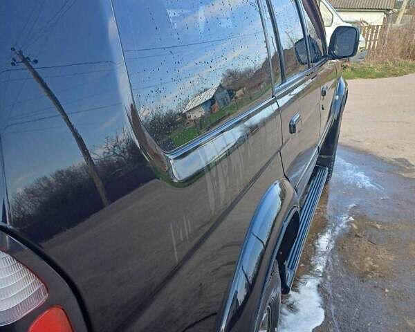 Черный Мицубиси Монтеро, объемом двигателя 3 л и пробегом 100 тыс. км за 11000 $, фото 4 на Automoto.ua