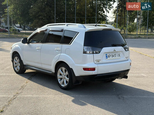 Белый Мицубиси Аутлендер ХЛ, объемом двигателя 2.36 л и пробегом 155 тыс. км за 10950 $, фото 89 на Automoto.ua