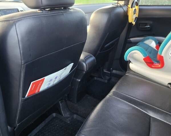 Білий Міцубісі Аутлендер ХЛ, об'ємом двигуна 2.36 л та пробігом 124 тис. км за 11300 $, фото 17 на Automoto.ua