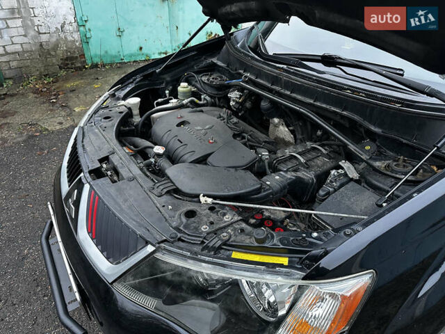 Черный Мицубиси Аутлендер ХЛ, объемом двигателя 2.4 л и пробегом 283 тыс. км за 8900 $, фото 32 на Automoto.ua