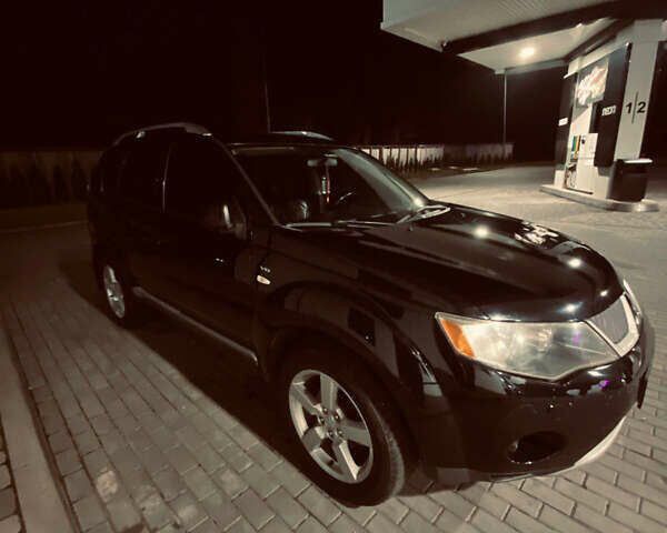 Черный Мицубиси Аутлендер ХЛ, объемом двигателя 3 л и пробегом 253 тыс. км за 9800 $, фото 2 на Automoto.ua