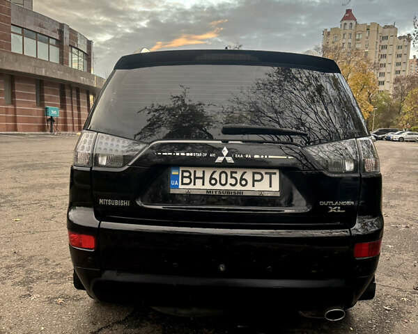 Черный Мицубиси Аутлендер ХЛ, объемом двигателя 2.4 л и пробегом 230 тыс. км за 8500 $, фото 6 на Automoto.ua