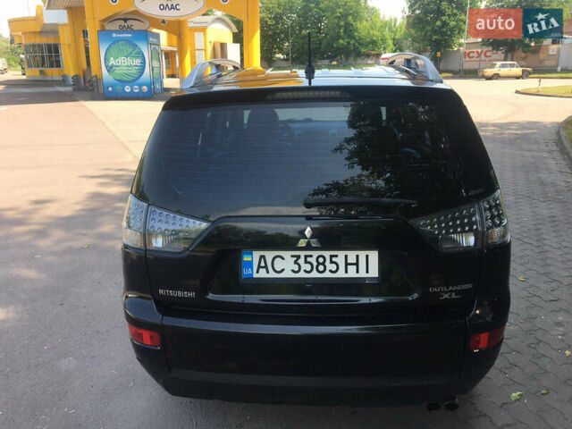 Черный Мицубиси Аутлендер ХЛ, объемом двигателя 3 л и пробегом 273 тыс. км за 9999 $, фото 5 на Automoto.ua