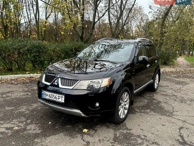 Черный Мицубиси Аутлендер ХЛ, объемом двигателя 2.4 л и пробегом 230 тыс. км за 8500 $, фото 1 на Automoto.ua