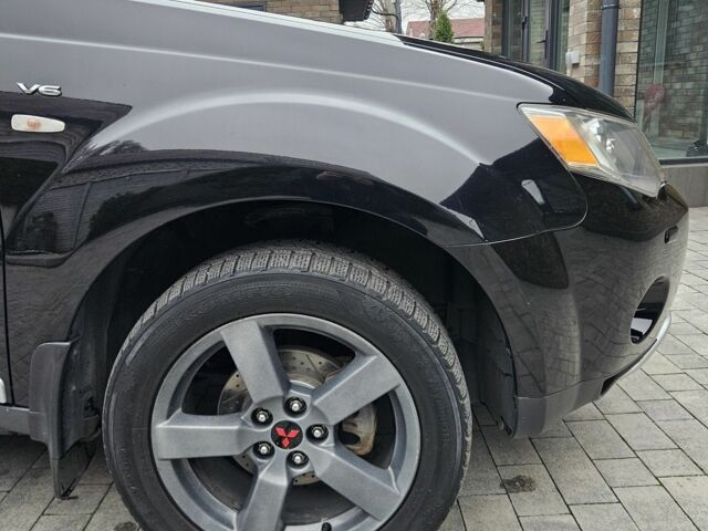 Чорний Міцубісі Аутлендер ХЛ, об'ємом двигуна 3 л та пробігом 238 тис. км за 10800 $, фото 12 на Automoto.ua