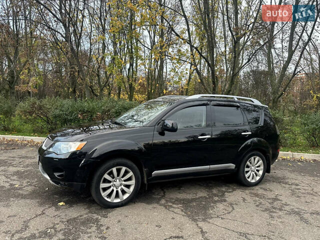 Черный Мицубиси Аутлендер ХЛ, объемом двигателя 2.4 л и пробегом 230 тыс. км за 8500 $, фото 4 на Automoto.ua