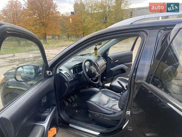 Черный Мицубиси Аутлендер ХЛ, объемом двигателя 1.97 л и пробегом 207 тыс. км за 8200 $, фото 11 на Automoto.ua