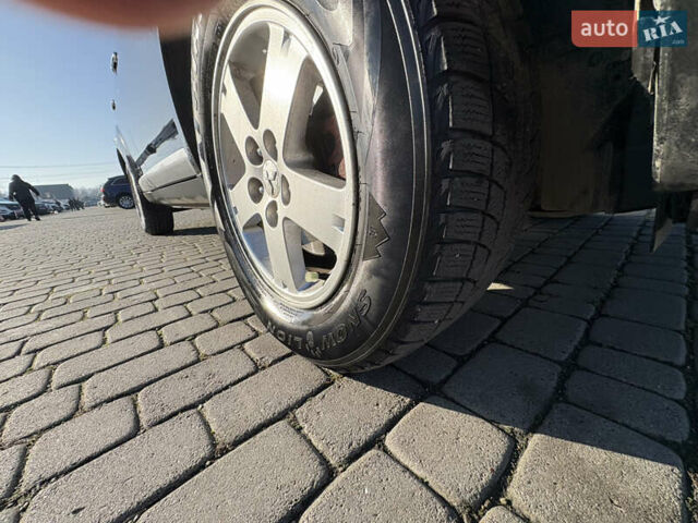 Черный Мицубиси Аутлендер ХЛ, объемом двигателя 2 л и пробегом 264 тыс. км за 7950 $, фото 19 на Automoto.ua