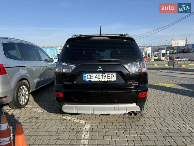 Черный Мицубиси Аутлендер ХЛ, объемом двигателя 2 л и пробегом 264 тыс. км за 7950 $, фото 4 на Automoto.ua