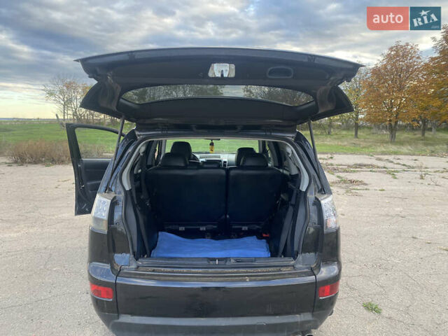 Черный Мицубиси Аутлендер ХЛ, объемом двигателя 1.97 л и пробегом 207 тыс. км за 8200 $, фото 4 на Automoto.ua