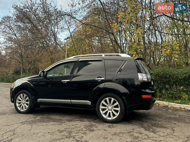 Черный Мицубиси Аутлендер ХЛ, объемом двигателя 2.4 л и пробегом 230 тыс. км за 8500 $, фото 5 на Automoto.ua