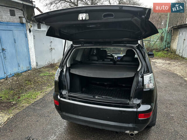 Черный Мицубиси Аутлендер ХЛ, объемом двигателя 2.4 л и пробегом 283 тыс. км за 8900 $, фото 24 на Automoto.ua