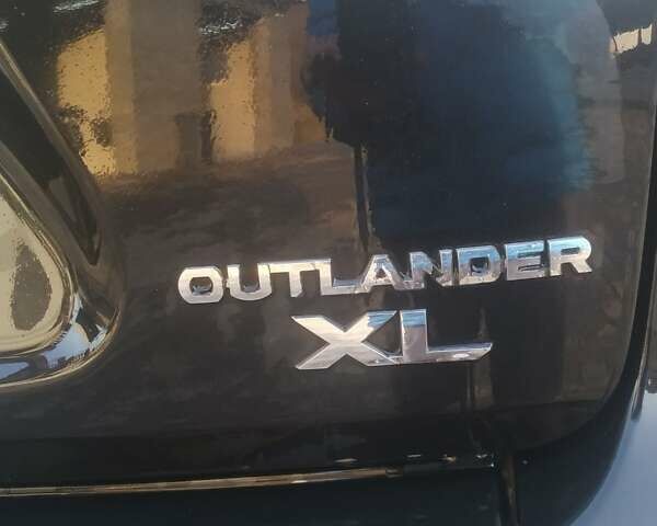 Черный Мицубиси Аутлендер ХЛ, объемом двигателя 3 л и пробегом 130 тыс. км за 6000 $, фото 5 на Automoto.ua