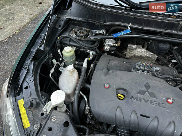 Черный Мицубиси Аутлендер ХЛ, объемом двигателя 2.4 л и пробегом 283 тыс. км за 8900 $, фото 30 на Automoto.ua