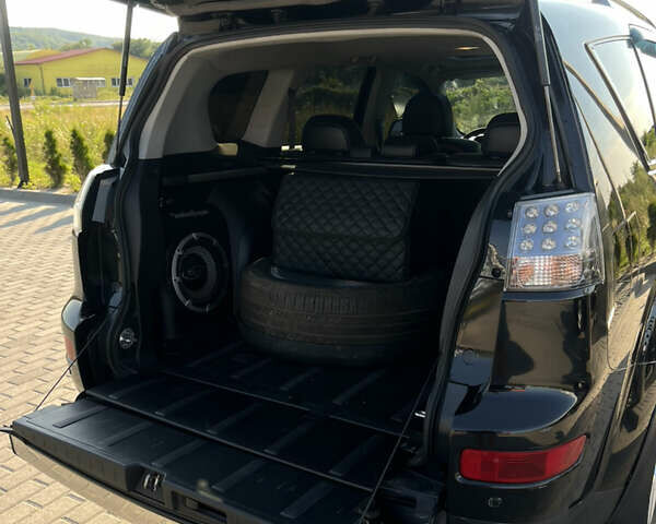 Черный Мицубиси Аутлендер ХЛ, объемом двигателя 2.99 л и пробегом 153 тыс. км за 10800 $, фото 8 на Automoto.ua