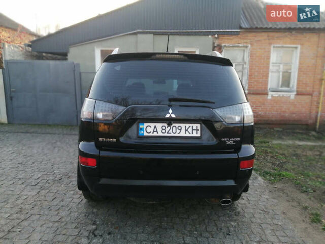 Чорний Міцубісі Аутлендер ХЛ, об'ємом двигуна 2.38 л та пробігом 228 тис. км за 7850 $, фото 4 на Automoto.ua