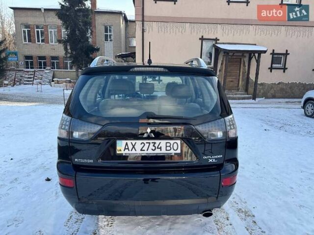 Черный Мицубиси Аутлендер ХЛ, объемом двигателя 2.36 л и пробегом 170 тыс. км за 10500 $, фото 2 на Automoto.ua