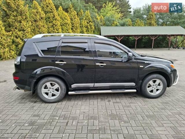 Черный Мицубиси Аутлендер ХЛ, объемом двигателя 2.4 л и пробегом 127 тыс. км за 10500 $, фото 7 на Automoto.ua