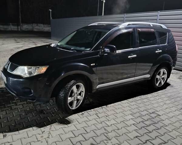 Чорний Міцубісі Аутлендер ХЛ, об'ємом двигуна 2.36 л та пробігом 390 тис. км за 7500 $, фото 1 на Automoto.ua