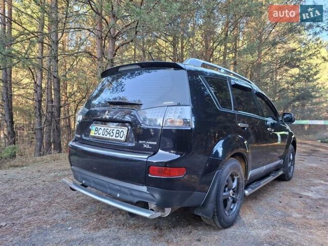 Черный Мицубиси Аутлендер ХЛ, объемом двигателя 2.4 л и пробегом 127 тыс. км за 10500 $, фото 25 на Automoto.ua