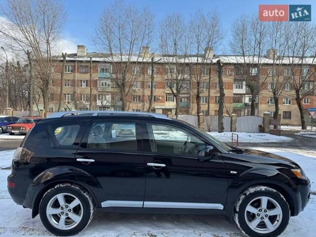 Черный Мицубиси Аутлендер ХЛ, объемом двигателя 2.36 л и пробегом 170 тыс. км за 10500 $, фото 5 на Automoto.ua