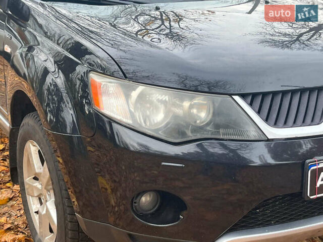 Черный Мицубиси Аутлендер ХЛ, объемом двигателя 3 л и пробегом 285 тыс. км за 9590 $, фото 2 на Automoto.ua