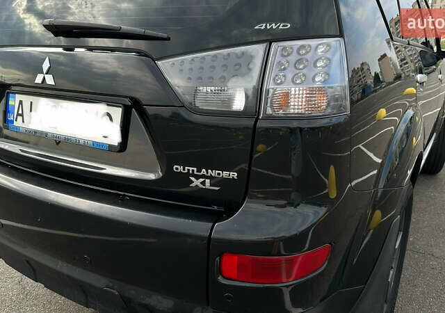 Черный Мицубиси Аутлендер ХЛ, объемом двигателя 2.4 л и пробегом 212 тыс. км за 9350 $, фото 43 на Automoto.ua