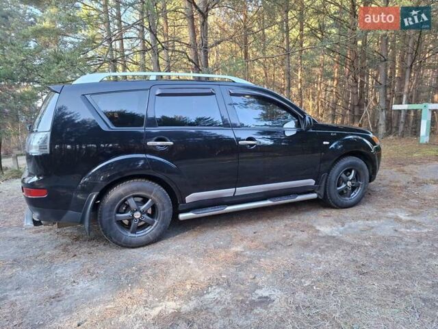 Черный Мицубиси Аутлендер ХЛ, объемом двигателя 2.4 л и пробегом 127 тыс. км за 10500 $, фото 27 на Automoto.ua