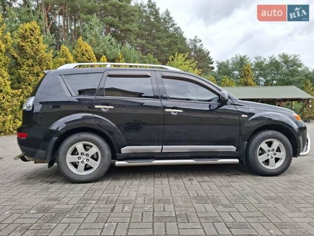 Черный Мицубиси Аутлендер ХЛ, объемом двигателя 2.4 л и пробегом 127 тыс. км за 10500 $, фото 8 на Automoto.ua