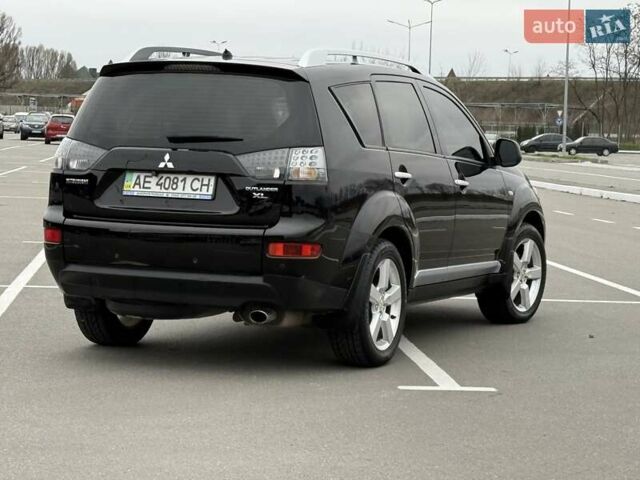 Черный Мицубиси Аутлендер ХЛ, объемом двигателя 2.36 л и пробегом 175 тыс. км за 9700 $, фото 5 на Automoto.ua