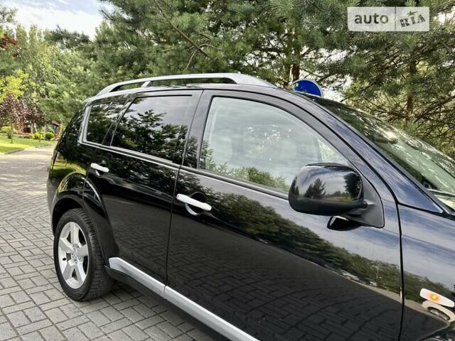 Чорний Міцубісі Аутлендер ХЛ, об'ємом двигуна 2 л та пробігом 172 тис. км за 9350 $, фото 12 на Automoto.ua