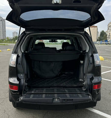 Черный Мицубиси Аутлендер ХЛ, объемом двигателя 2.4 л и пробегом 212 тыс. км за 9350 $, фото 7 на Automoto.ua