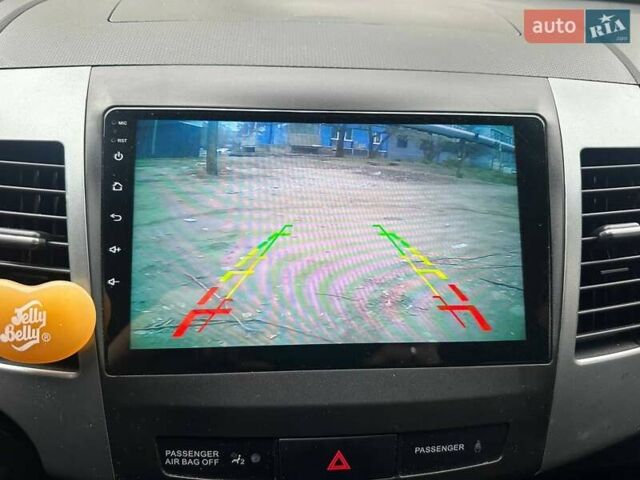 Черный Мицубиси Аутлендер ХЛ, объемом двигателя 2.36 л и пробегом 250 тыс. км за 10000 $, фото 30 на Automoto.ua