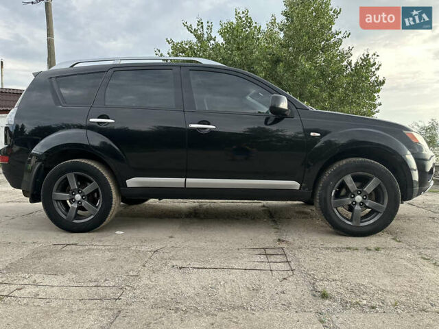 Черный Мицубиси Аутлендер ХЛ, объемом двигателя 2.4 л и пробегом 212 тыс. км за 9350 $, фото 4 на Automoto.ua